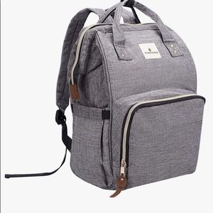 New in package gray diaper bag with pad - attaches to stroller ,holds bottles